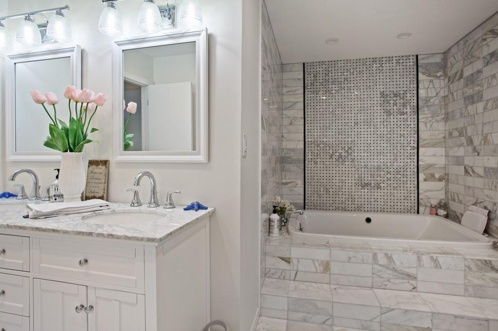 Marble master bathroom — soaking tub, double vanity, custom tile Long Island