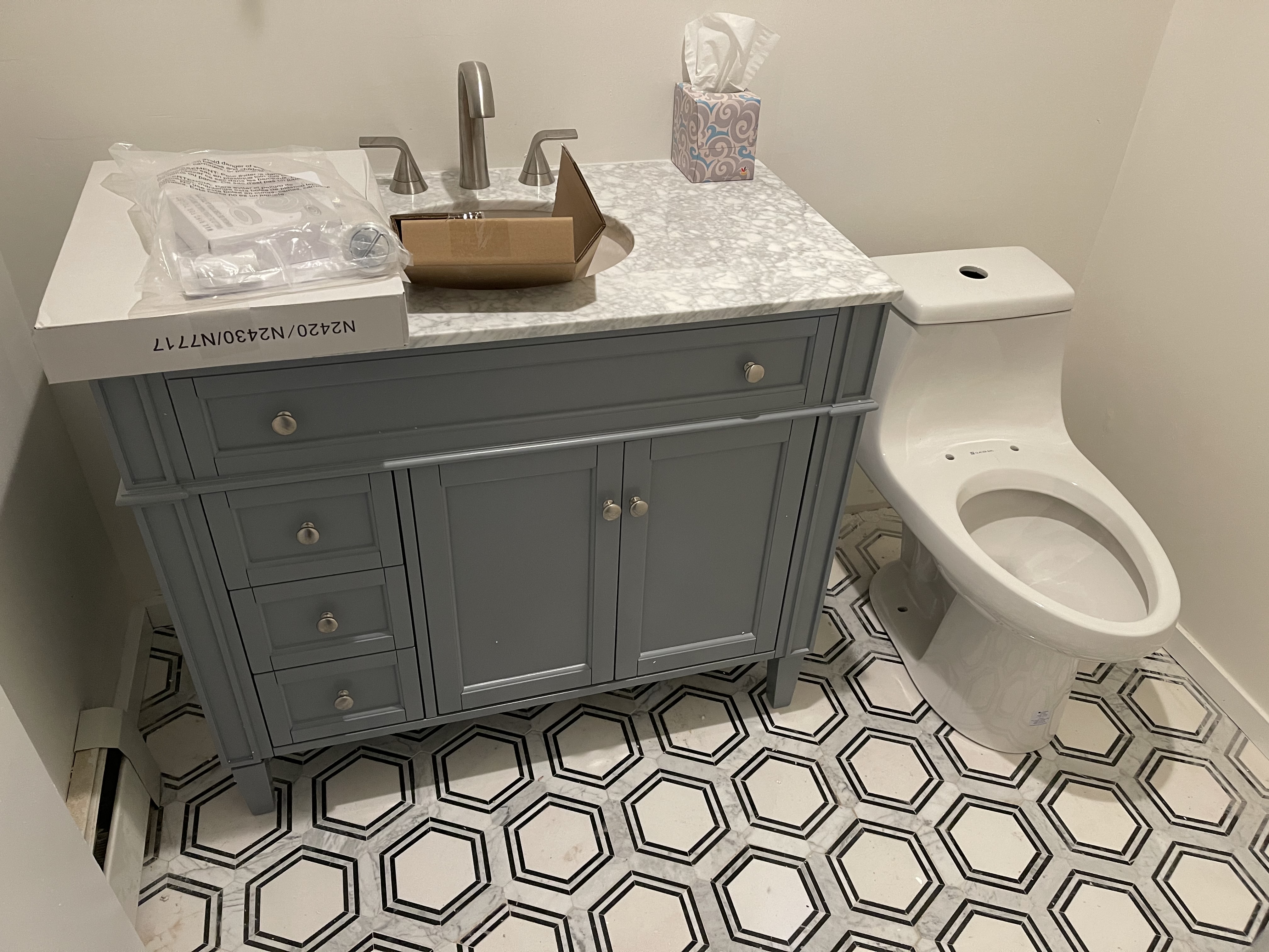 Bathroom with decorative patterned tile floor — full renovation Long Island