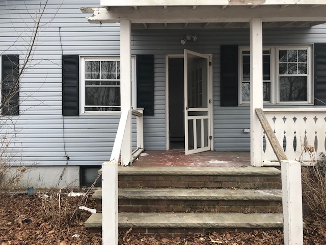 Front porch before — weathered steps and entry